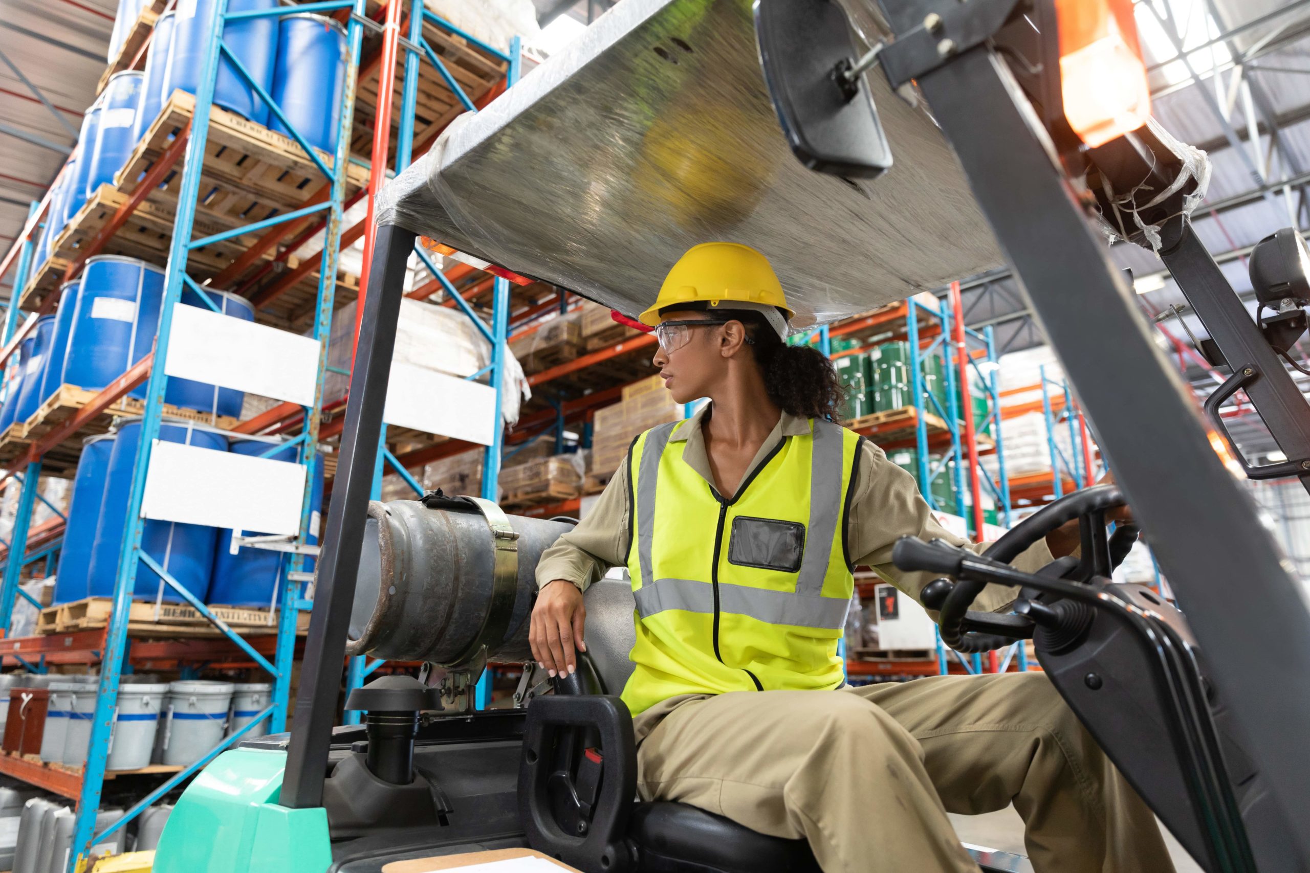 Forklift operator looking in reverse before traveling