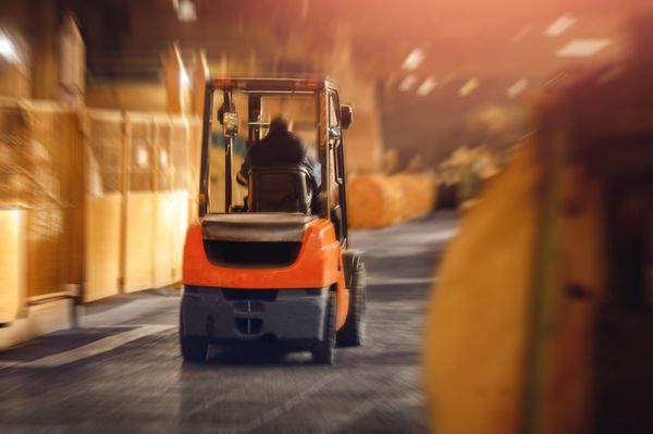 Blurred Forklift in Warehouse