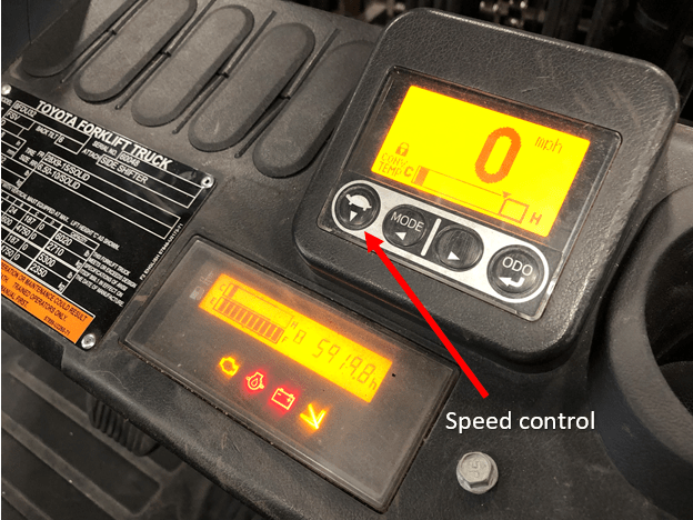 Speed control button on the instrument panel of an internal combustion Toyota forklift
