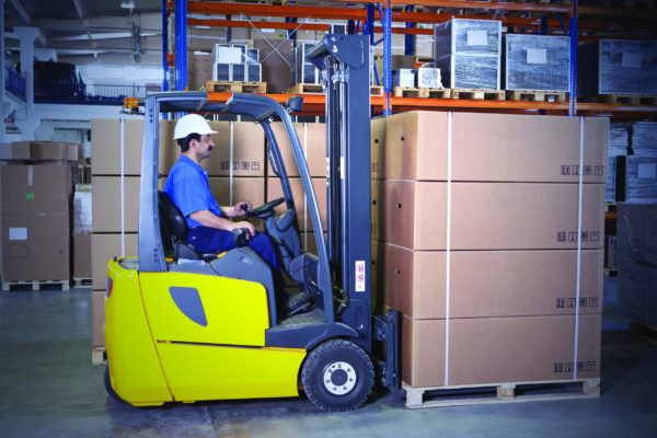 A forklift operator about to transport a tall load that's blocking their sight