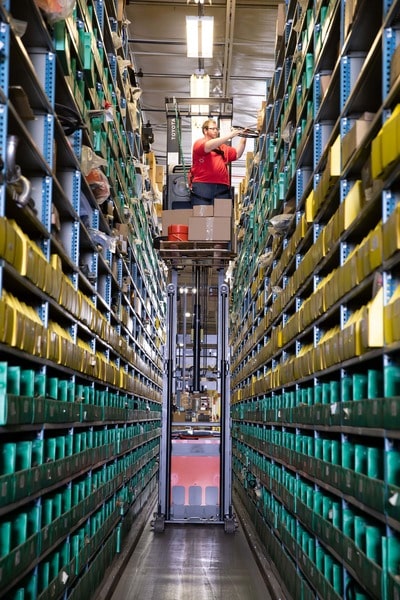 A very narrow aisle between pallet racking