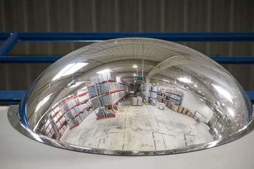 A convex wall-mounted warehouse mirror