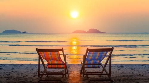 Empty chairs on a beach