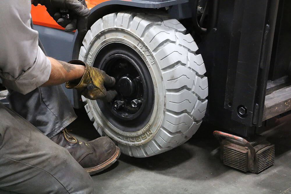 tire technician replace solid pneumatic