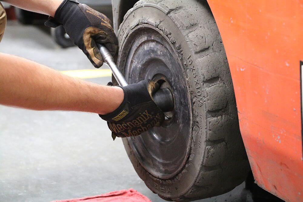 technician removes castle nut