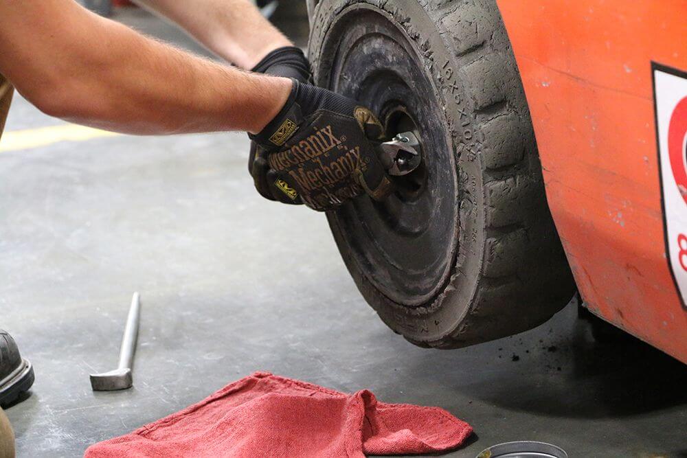 technician removes cotter pin