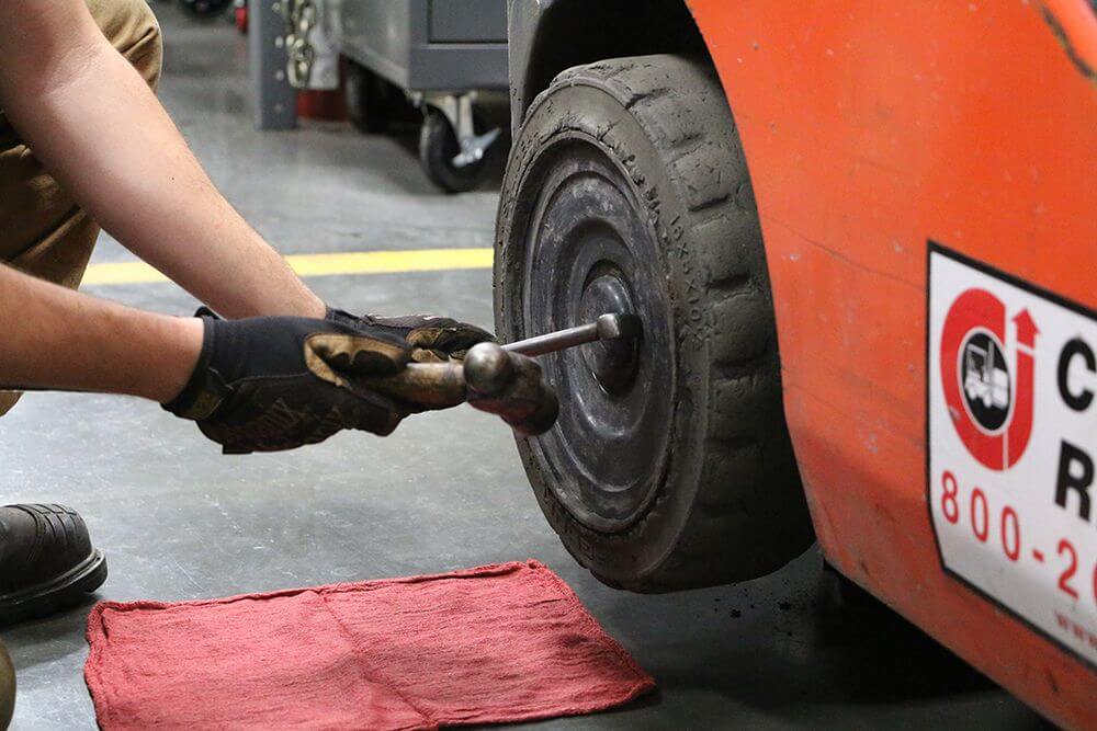 technician removes dust cap