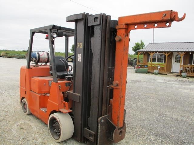 Cushion forklift with a double mast and boom attachment