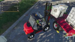 Manitou forklift loading a semi trailer