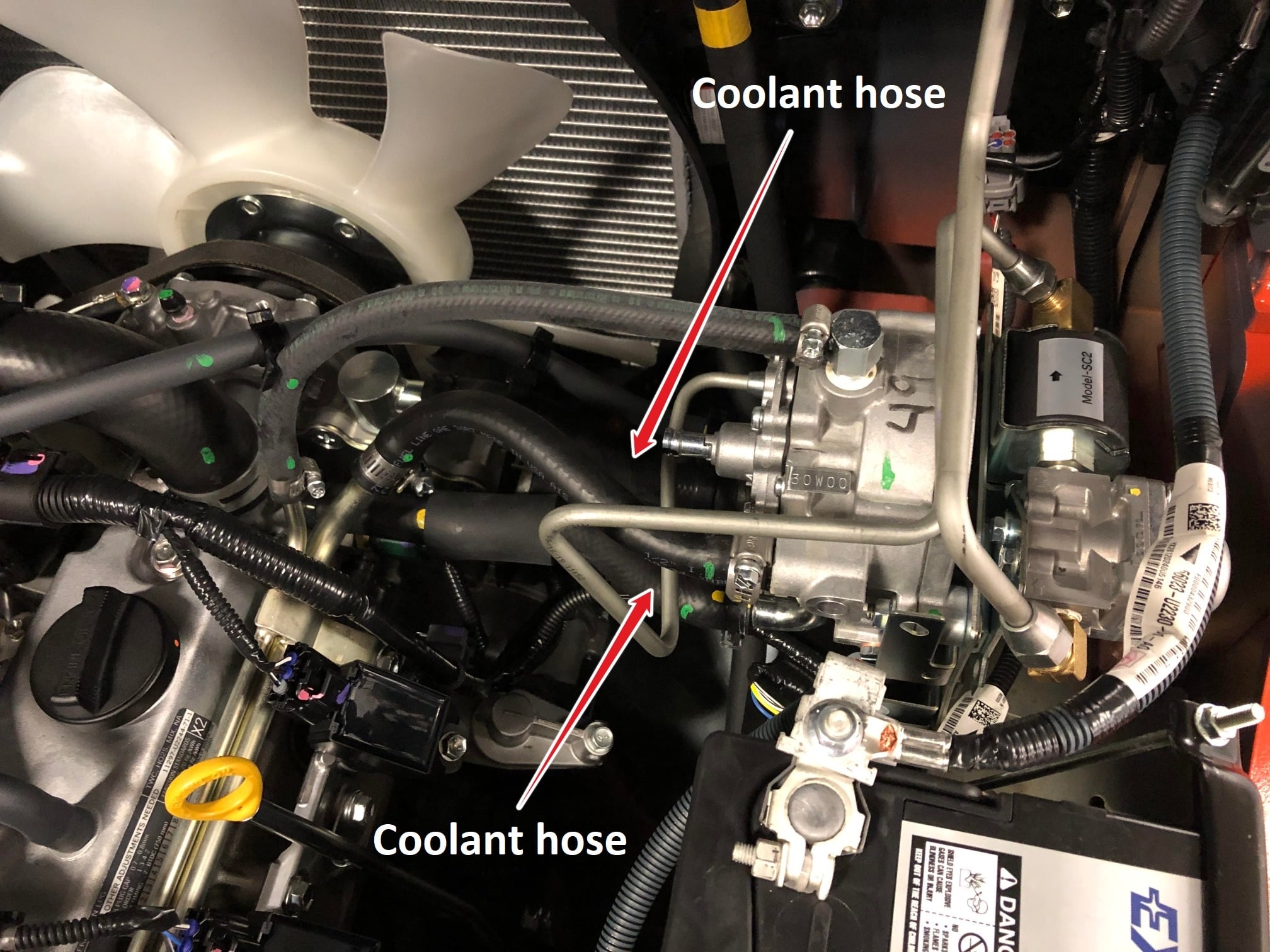The location of the two coolant lines connected to a Toyota forklift regulator