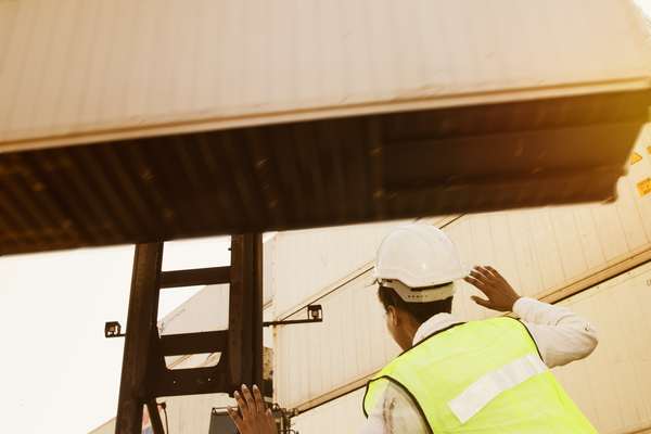 A forklift load about to fall on a pedestrian