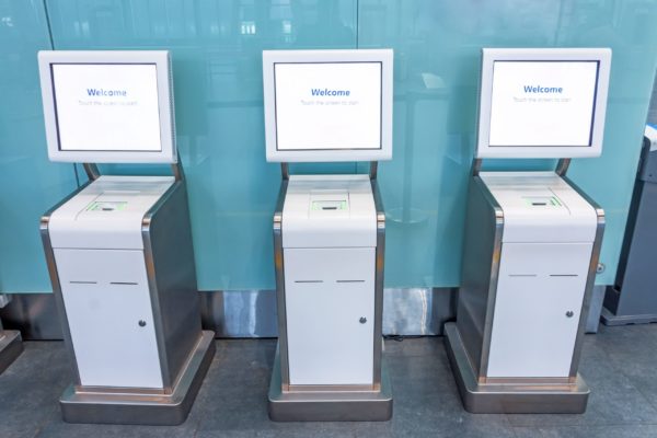 Three automated kiosks in an airport