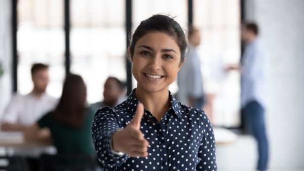 A woman reaching out her hand for a handshake