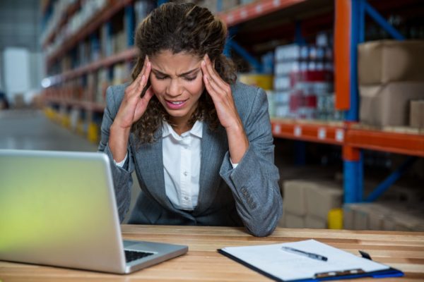 A warehouse manager stressed because of work