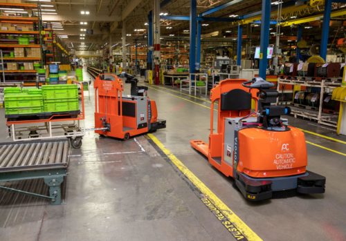 Toyota automated pallet jack and tow tractors in action
