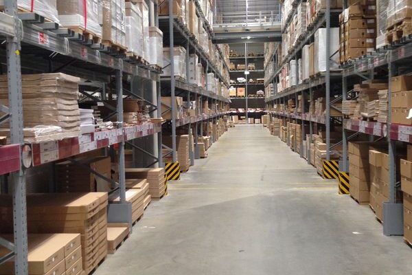 Looking down a warehouse aisle with pallet racking on either side