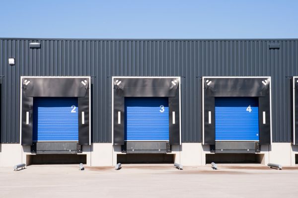 Three warehouse docks viewed from outside