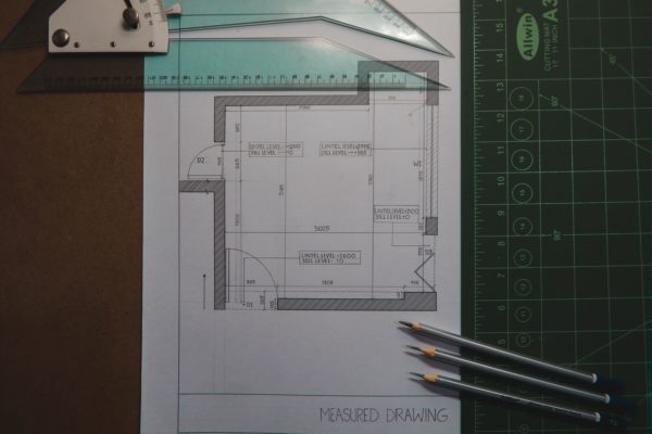 paper-pencil-floor-plan-drawing A floor plan drawing on paper