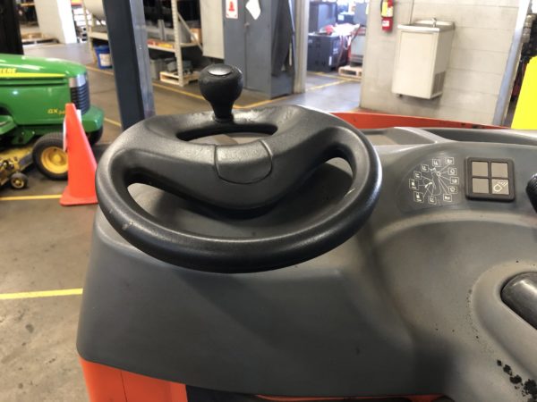The steering wheel on a reach truck