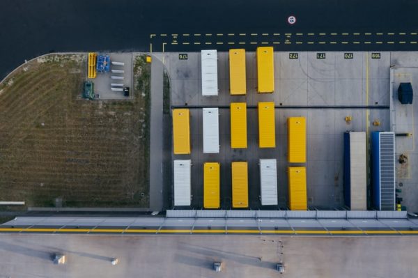 separate-loading-docks Containers lined up outside a loading dock
