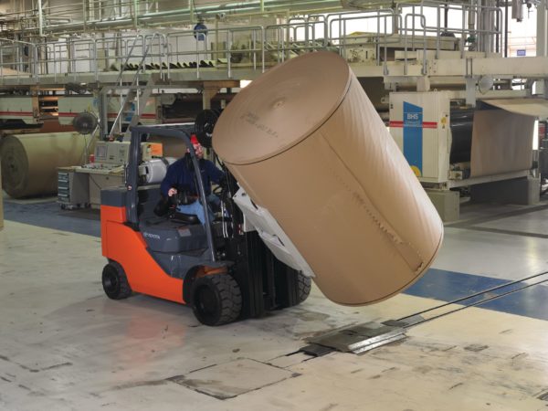 A Toyota Paper Roll Special forklift rotating a paper roll