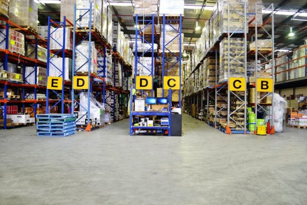 warehouse-shelving-ecommerce Looking forward at warehouse racking endcaps