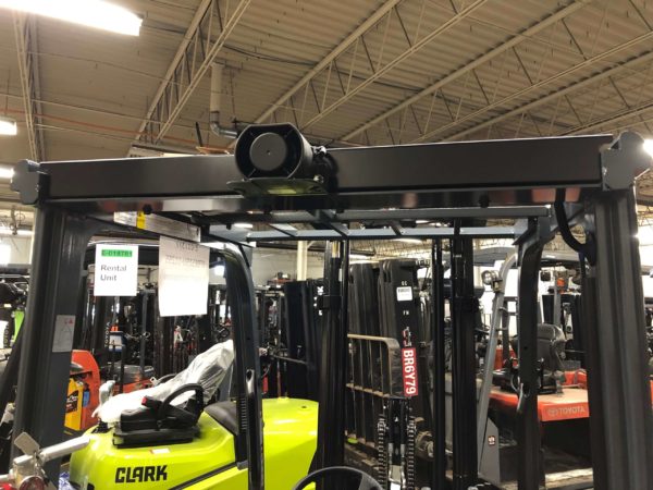 A back-up alarm mounted on the rear of a Toyota forklift