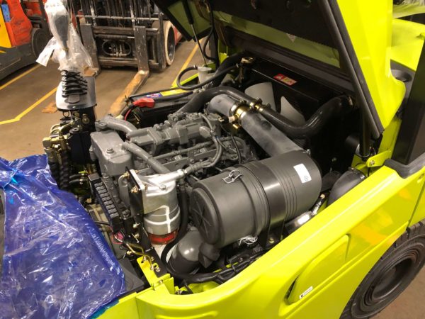 The engine compartment on a CLARK forklift