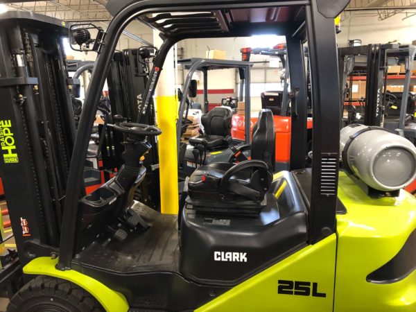The operator compartment on a CLARK pneumatic forklift