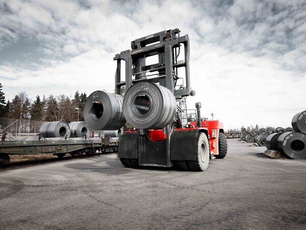 A Kalmar DCG620 forklift lifting two rolls of steel
