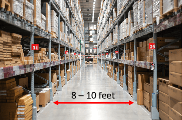 A narrow warehouse aisle