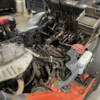 toyota forklift with floorboards off being repaired