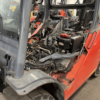 toyota lift truck with floor boards removed being serviced