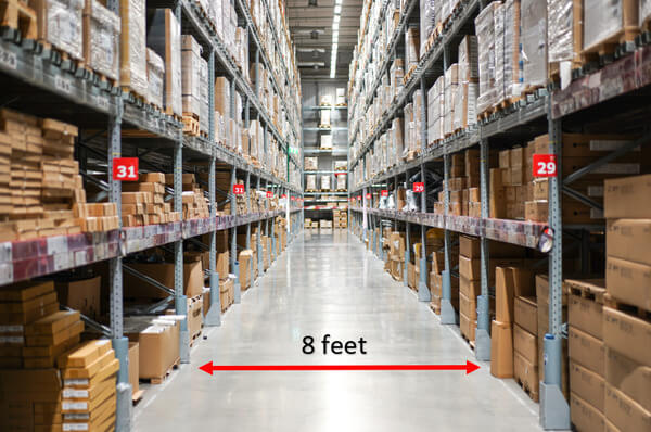 A narrow warehouse aisle