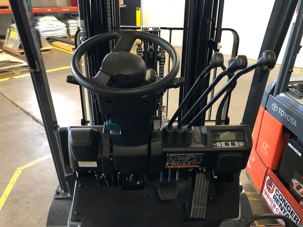 The controls of a 3-wheel sit-down forklift