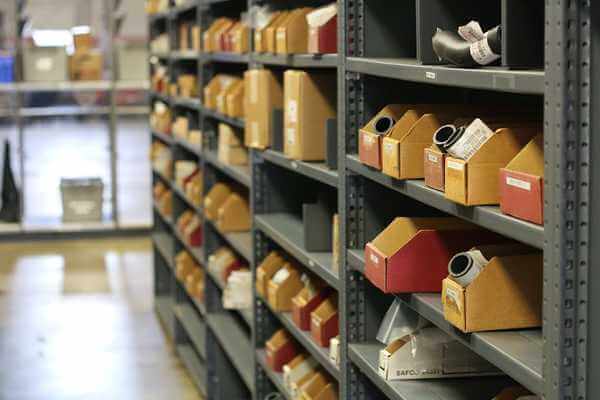 A row of shelves with forklift parts on them