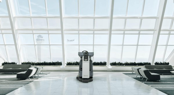 An Advance Liberty SC60 autonomous floor scrubber in an airport