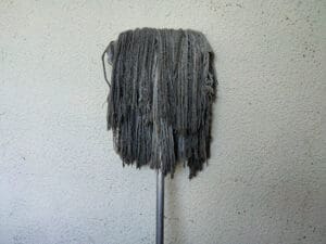 dirty-mop-hanging-on-wall