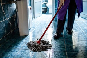 workers-cleaning-floor-with-mop-and-bucket