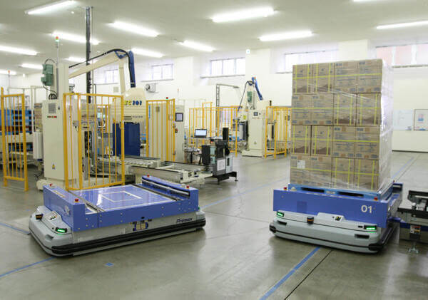 Unit-load AGVs carrying a pallet of boxes