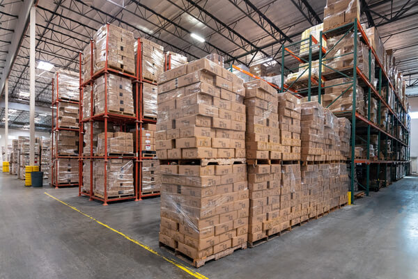 Pallets stacked on top of pallets in a warehouse