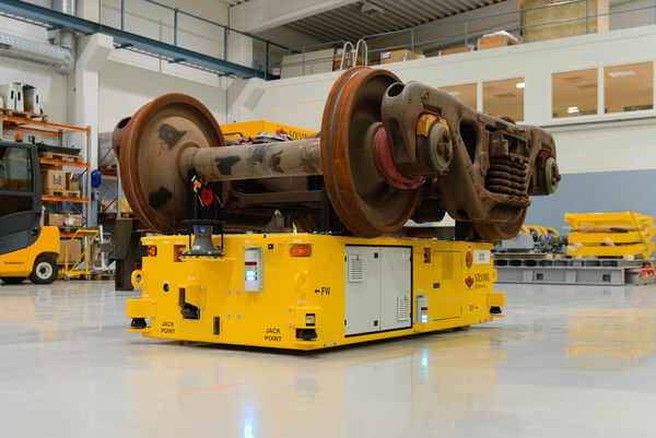 A heavy-haul AGV transporting a train axle