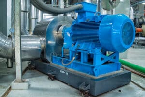 Pump connected to piping in an industrial facility