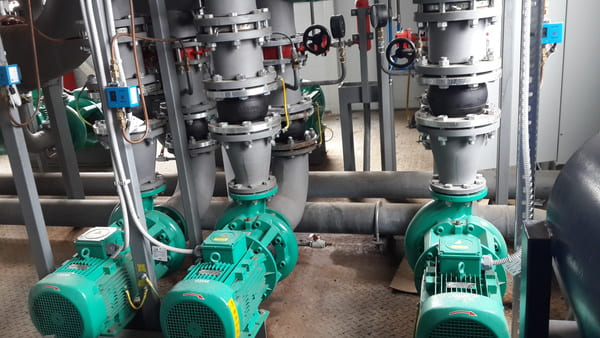 Pumps connected to piping in an industrial facility