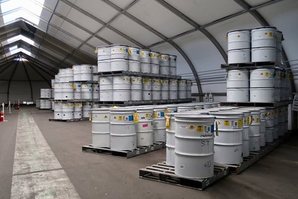 A hazardous materials warehouse storing barrels of radioactive waste