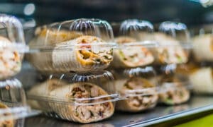 Pre-packaged foods in a refrigerated grocery store display case