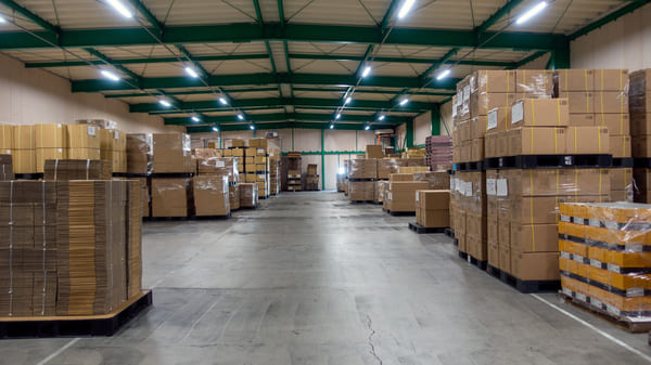 Stacks of pallets sitting in a warehouse