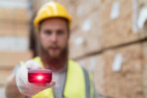 An RF scanner projecting a red laser light