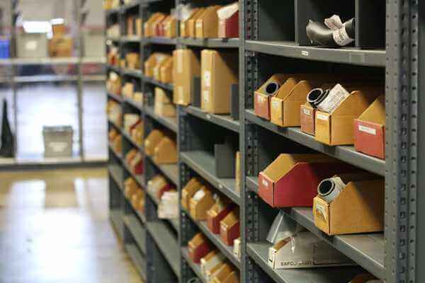 An aisle displaying forklift parts in bins