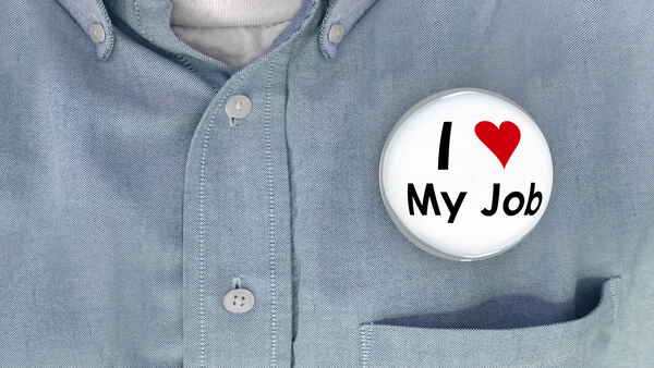 An "I Love My Job" button pinned on a shirt